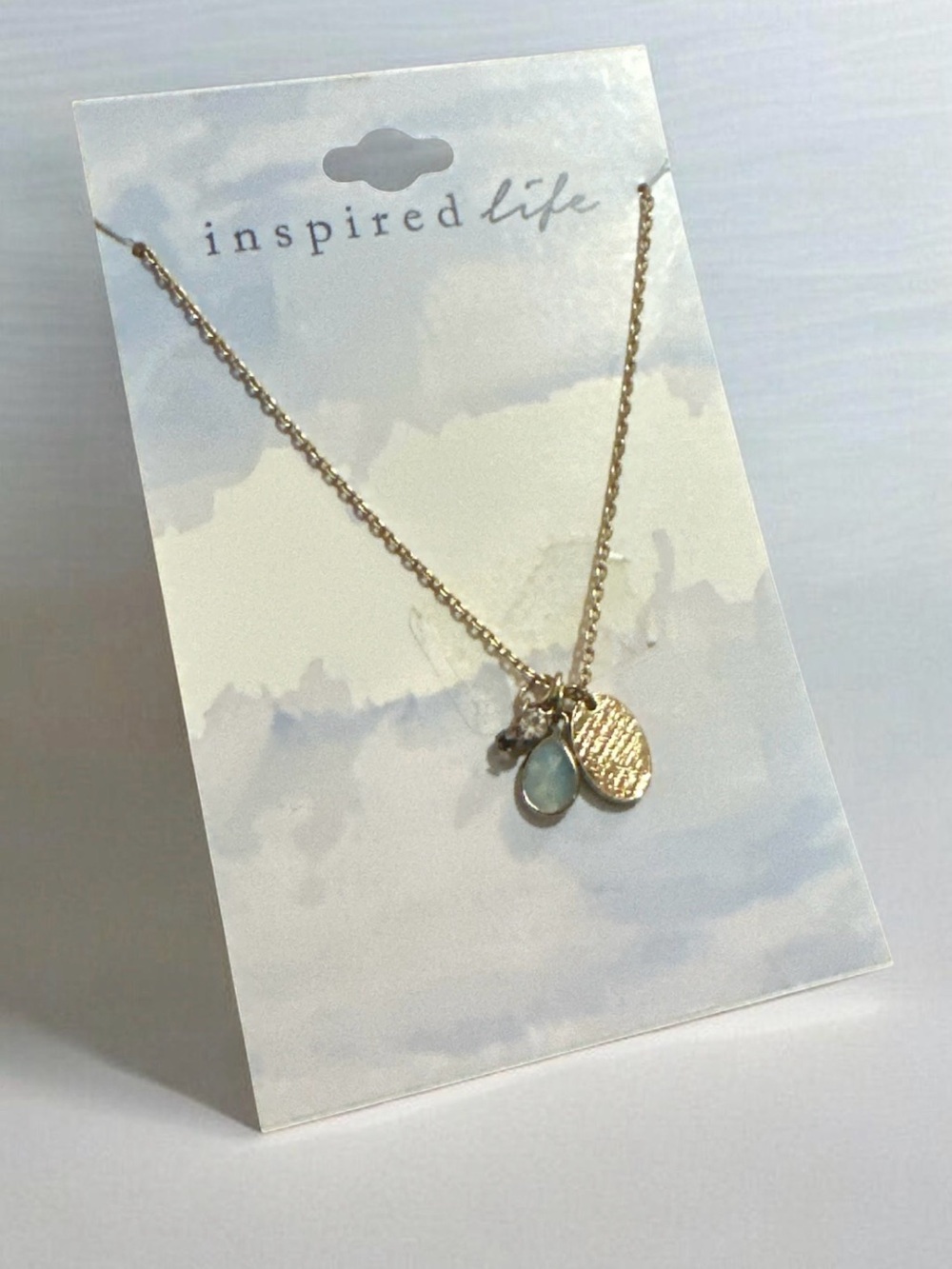 Inspire Gold Pendant Necklace with Light Blue Teardrop Charm
2059